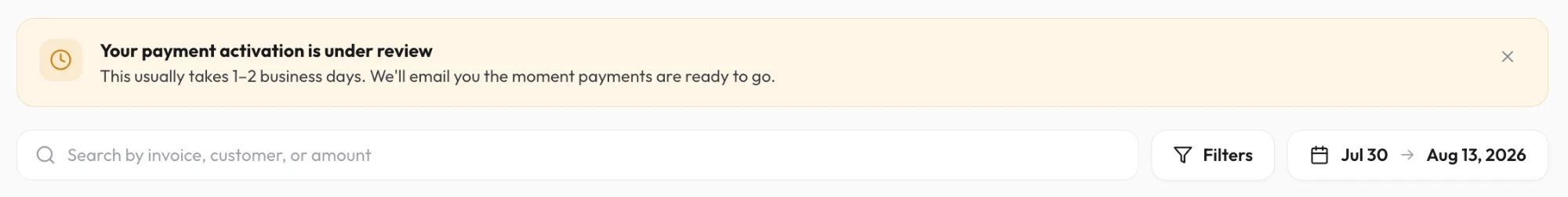 Amber banner on the invoices page: your payment activation is under review, usually 1–2 business days